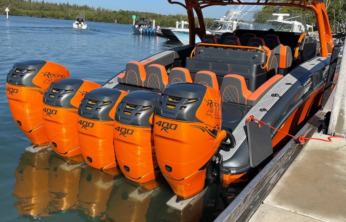 Five Mercury outboards on a center console at the dock